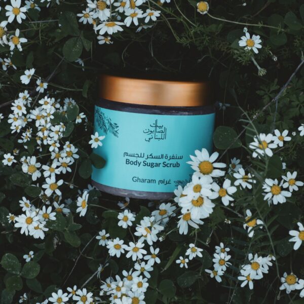 Naturally luxurious, fragrant and handmade skincare Gharam Body Sugar Scrub by House of Soap in flowers